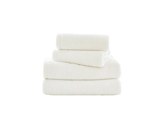Stack of white towels on a white background